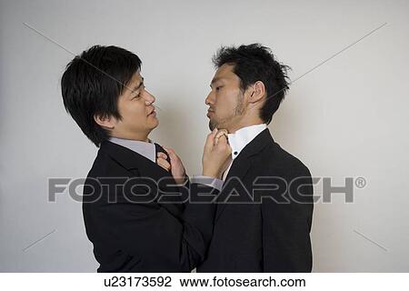 Stock Image - Two businessmen fighting. Fotosearch