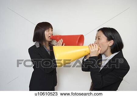 Two young businesswomen shouting View Large Photo Image Stock Image - Two young businesswomen shouting. Fotosearch