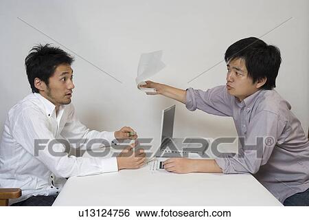 Two young men arguing View Large Photo Image Stock Photograph - Two young men arguing. Fotosearch
