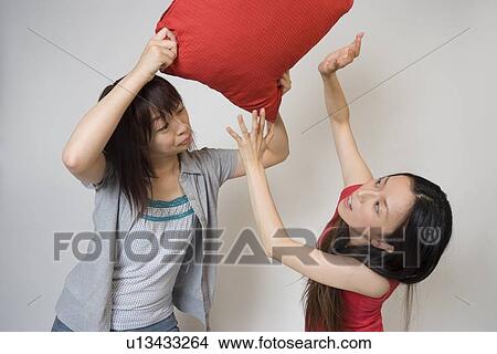 Picture - Two young women fighting. Fotosearch