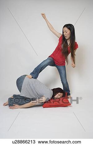 Young woman bullying another woman View Large Photo Image Stock Image - Young woman bullying another woman. Fotosearch