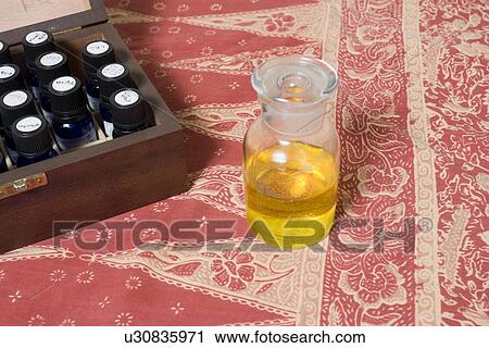 Stock Image - Aromatherapy oils in a box. Fotosearch