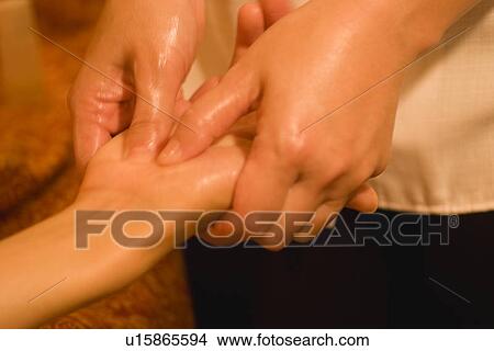 Therapist massaging patient's hand View Large Photo Image Picture - Therapist massaging patient's hand. Fotosearch