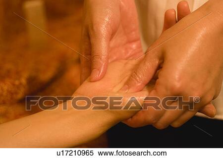 Stock Photography - Therapist massaging patient's hand. Fotosearch