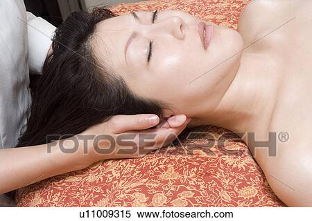 Stock Photography - Young woman receiving massage. Fotosearch
