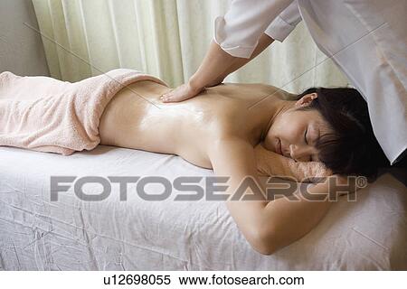 Young woman receiving massage View Large Photo Image Stock Photography - Young woman receiving massage. Fotosearch