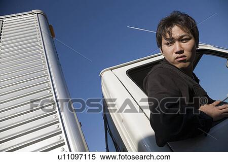Driver driving truck backward View Large Photo Image Stock Photography - Driver driving truck backward. Fotosearch