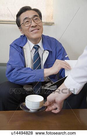 Stock Photo - Mature businessman smiling. Fotosearch