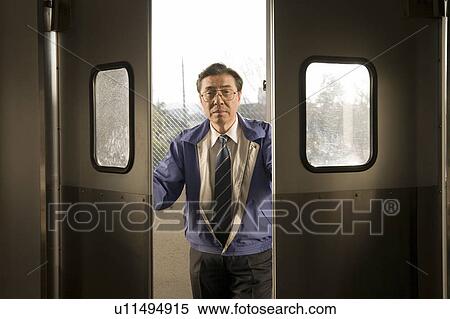 Stock Photography - Mature man opening door. Fotosearch