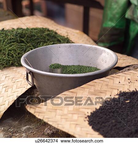 Picture - Display of spices by Burmese merchants on street in Bago. Fotosearch