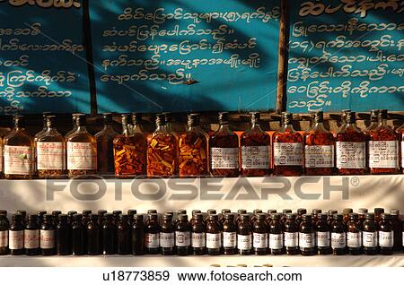 Stock Photo - Row of bottles on a shelf. Fotosearch