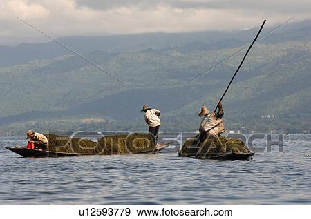Farmers in row boat View Large Photo Image Stock Photo - Farmers in row boat. Fotosearch