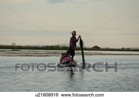 Fisherman leg rowing View Large Photo Image Stock Photograph - Fisherman leg rowing. Fotosearch