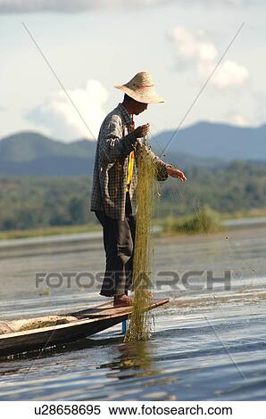 Stock Photography - Fisherman with fishing net. Fotosearch