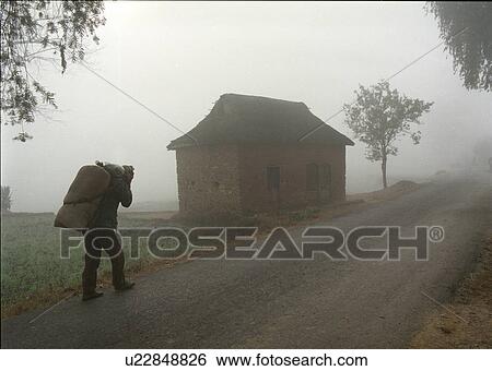 Stock Photograph - Man with Sack - Nepal. Fotosearch