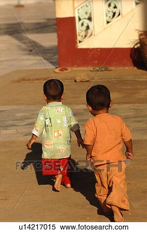 Stock Photography - Toddlers walking away from camera. Fotosearch