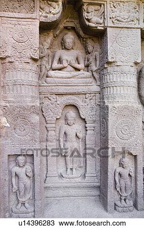 Stock Image - Buddha statues in a cave, Ajanta, Maharashtra, India. Fotosearch