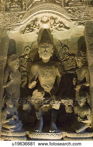 Stock Image - Buddha statues in a cave, Ajanta, Maharashtra, India. Fotosearch