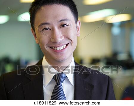 Businessman in office, close-up, portrait View Large Photo Image Stock Photo - Businessman in office, close-up, portrait. Fotosearch