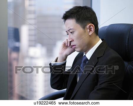 Businessman using mobile phone View Large Photo Image Stock Photography - Businessman using mobile phone. Fotosearch