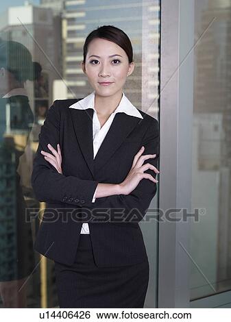 Stock Photograph - Businesswoman arms crossed. Fotosearch