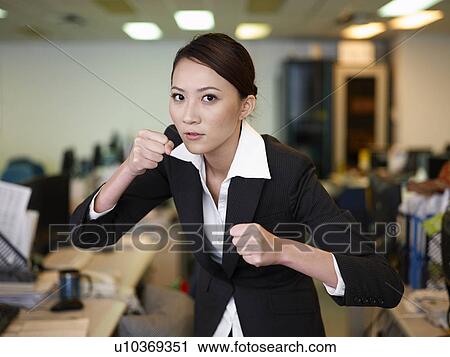 Businesswoman clenching fist View Large Photo Image Stock Image - Businesswoman clenching fist. Fotosearch