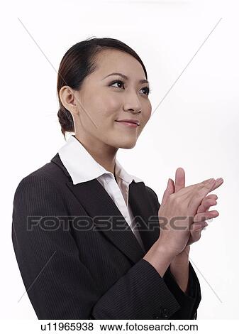 Stock Photo - Businesswoman applauding, close-up. Fotosearch