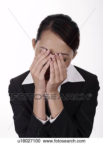 Businesswoman covering her face in despair View Large Photo Image Stock Image - Businesswoman covering her face in despair. Fotosearch