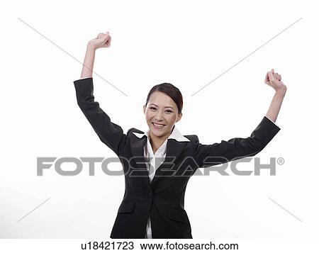 Stock Image - Businesswoman hands raised in air. Fotosearch