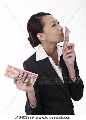 Businesswoman holding banknotes View Large Photo Image Stock Photo - Businesswoman holding banknotes. Fotosearch