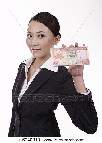 Businesswoman holding handful of banknotes View Large Photo Image Stock Photo - Businesswoman holding handful of banknotes. Fotosearch