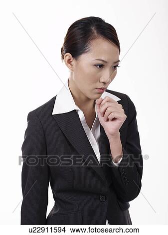 Picture - Businesswoman looking down. Fotosearch