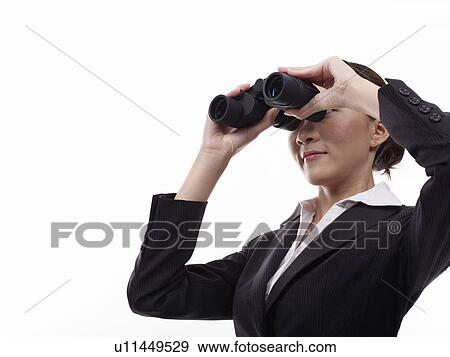Businesswoman looking through binoculars View Large Photo Image Stock Photo - Businesswoman looking through binoculars. Fotosearch