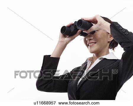 Stock Photo - Businesswoman looking through binoculars. Fotosearch