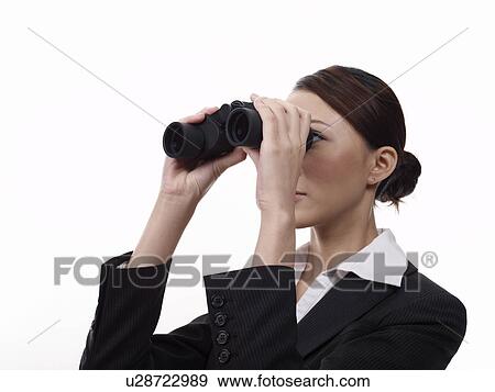 Businesswoman looking through binoculars View Large Photo Image Stock Photo - Businesswoman looking through binoculars. Fotosearch