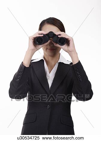 Businesswoman looking through binoculars View Large Photo Image Stock Photography - Businesswoman looking through binoculars. Fotosearch