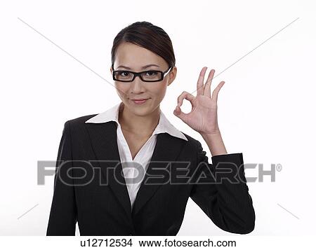 Businesswoman making OK Gesture View Large Photo Image Picture - Businesswoman making OK Gesture. Fotosearch