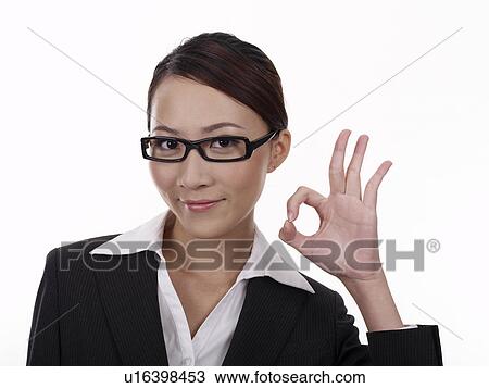 Stock Image - Businesswoman making OK Gesture. Fotosearch