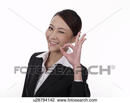 Businesswoman making OK Gesture View Large Photo Image Stock Image - Businesswoman making OK Gesture. Fotosearch