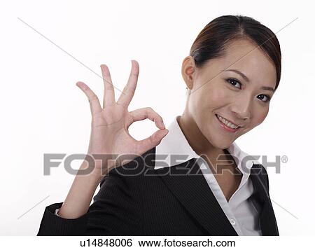 Businesswoman making OK Gesture View Large Photo Image Stock Photograph - Businesswoman making OK Gesture. Fotosearch