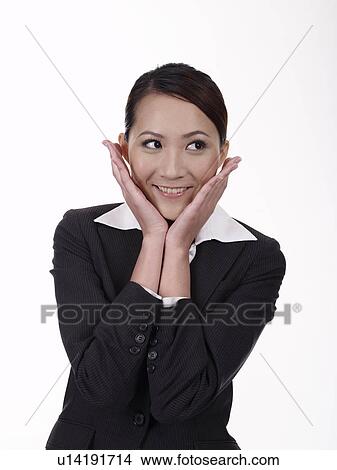 Businesswoman placing hand aside cheek, portrait View Large Photo Image Picture - Businesswoman placing hand aside cheek, portrait. Fotosearch