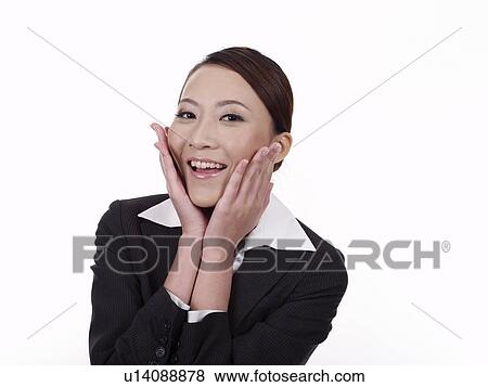Stock Photo - Businesswoman placing hand aside cheek, portrait. Fotosearch