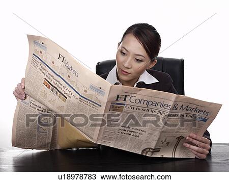 Businesswoman reading newspaper View Large Photo Image Stock Image - Businesswoman reading newspaper. Fotosearch