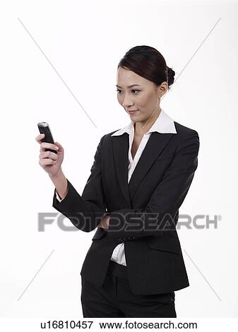 Businesswoman receiving text message View Large Photo Image Stock Photo - Businesswoman receiving text message. Fotosearch