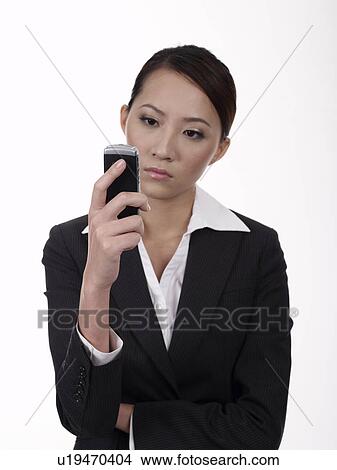 Businesswoman receiving unexpected text message View Large Photo Image Picture - Businesswoman receiving unexpected text message. Fotosearch