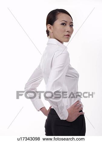 Businesswoman standing with hands on hips View Large Photo Image Stock Photo - Businesswoman standing with hands on hips. Fotosearch