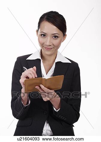Businesswoman taking notes View Large Photo Image Stock Image - Businesswoman taking notes. Fotosearch