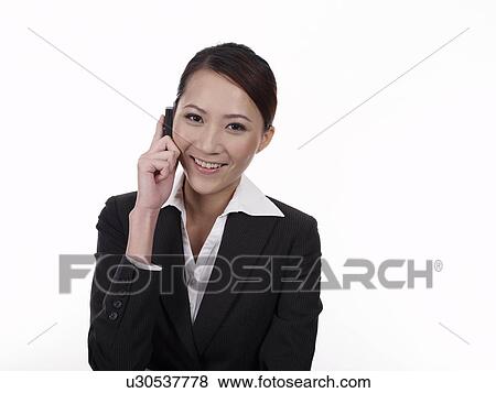 Businesswoman using mobile phone View Large Photo Image Stock Photo - Businesswoman using mobile phone. Fotosearch