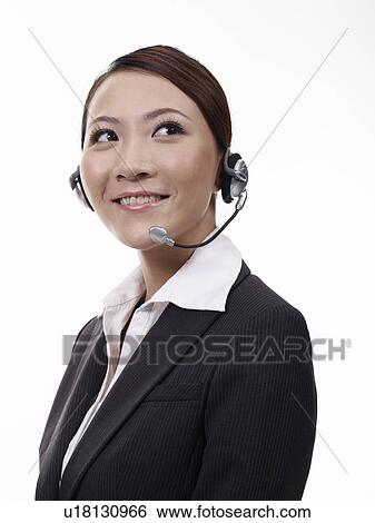 Woman wearing headset, portrait, close-up View Large Photo Image Stock Photograph - Woman wearing headset, portrait, close-up. Fotosearch