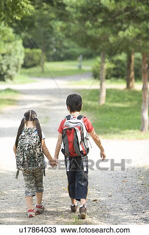 Brother and Sister Walking on Alley Hand in Hand View Large Photo Image Stock Image - Brother and Sister Walking on Alley Hand in Hand. Fotosearch